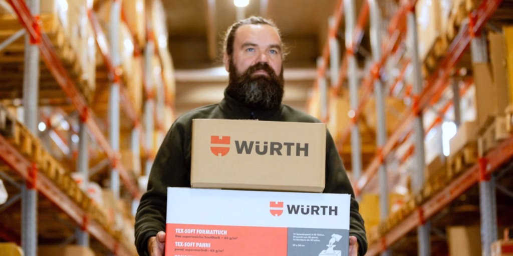 person with packages in warehouse