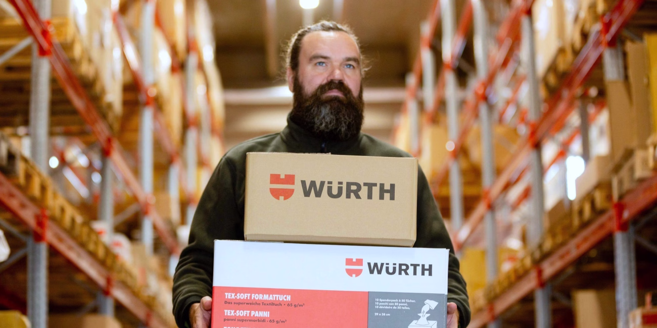 person with packages in warehouse